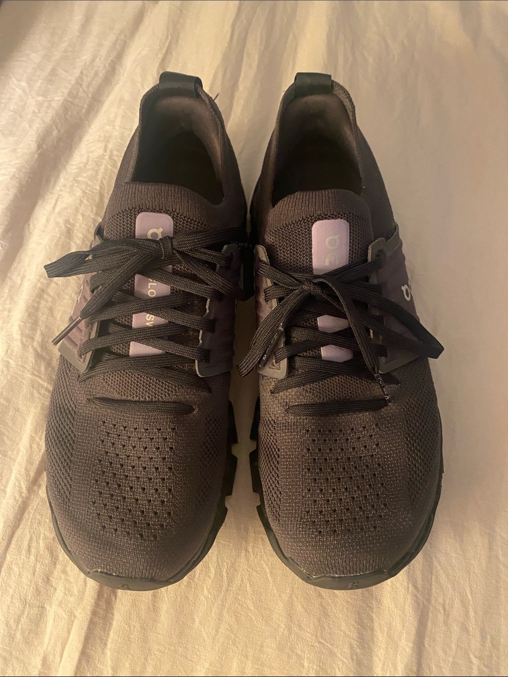 Barely worn On Running Black Sneakers with Lavender Tongue Accents